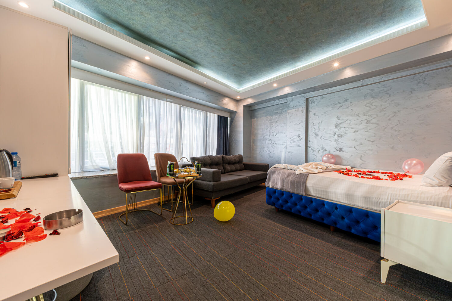 Experience ultimate relaxation at a sunlit tropical poolside resort featuring palm trees and blue skies.