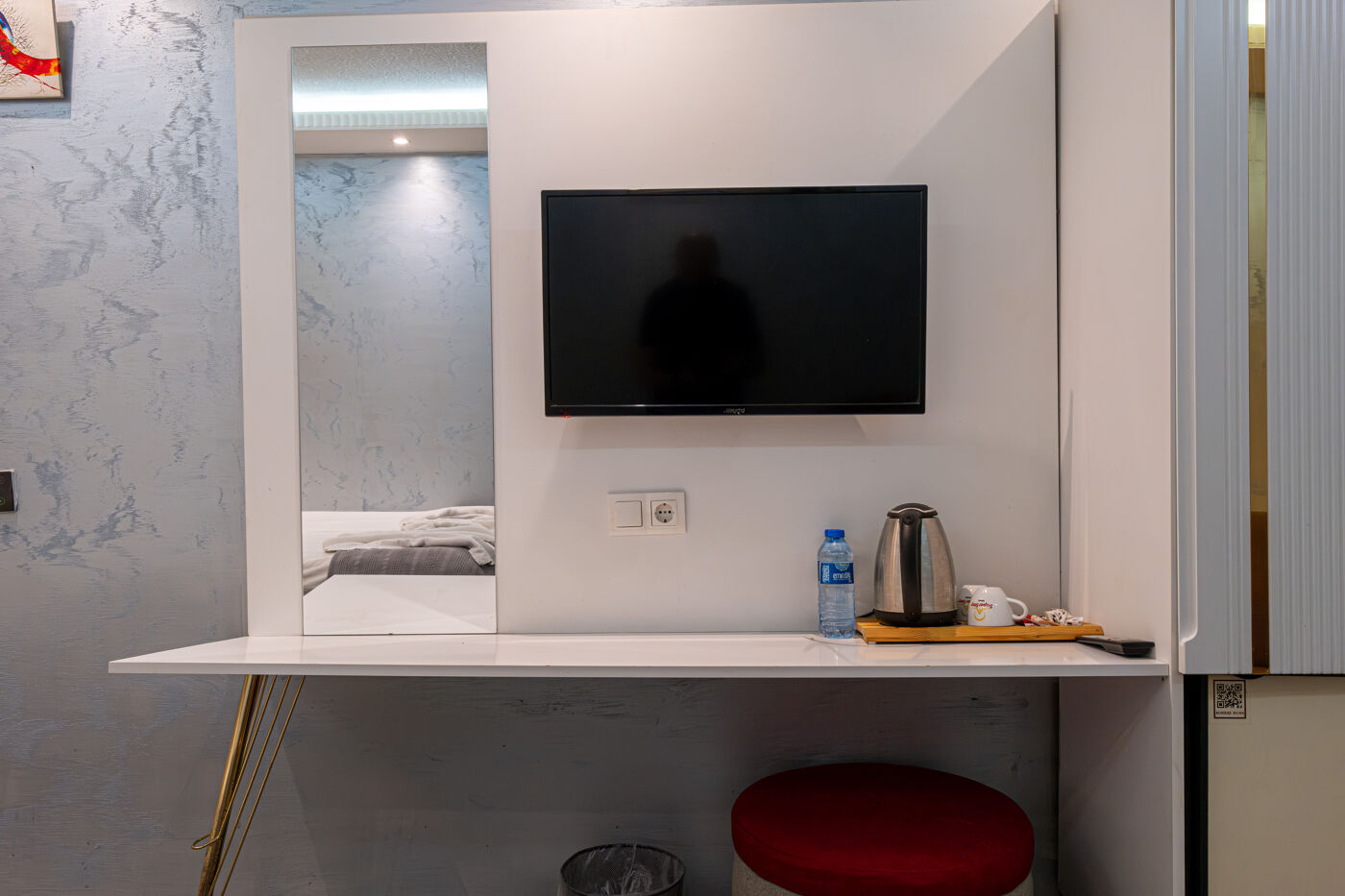 Outdoor swimming pool with sunbeds